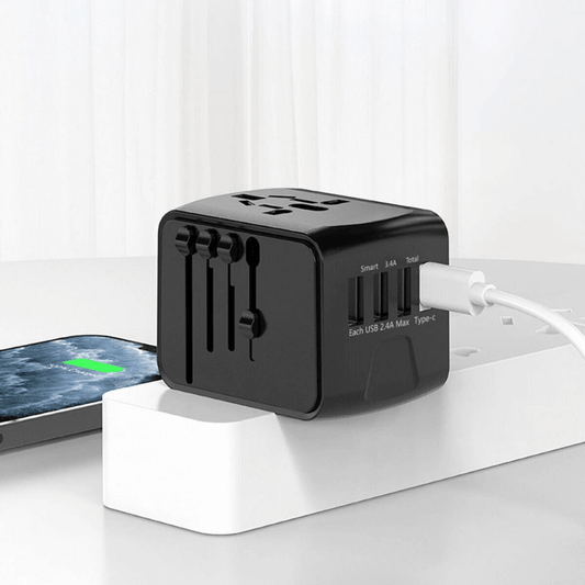 Black multi-port charger with USB cable on a white surface